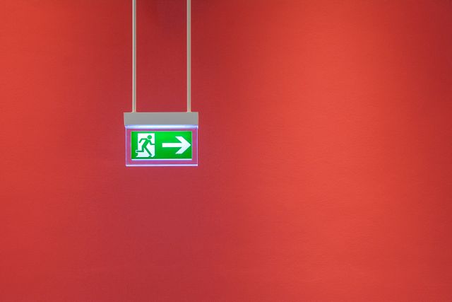 Fire exit kept clear of Christmas decorations in a UK commercial premises