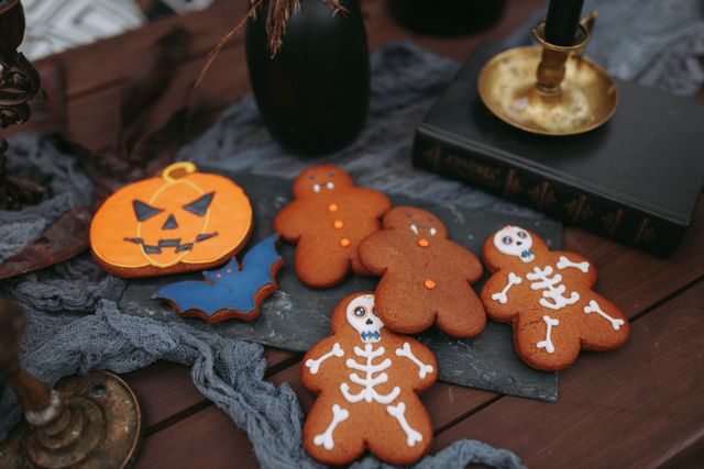 Styled Halloween dessert table with gold and black accents for a Bristol party