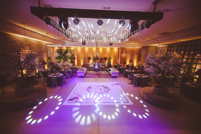 Corporate Christmas party decoration with balloon garland and LED dance floor hire in Bristol