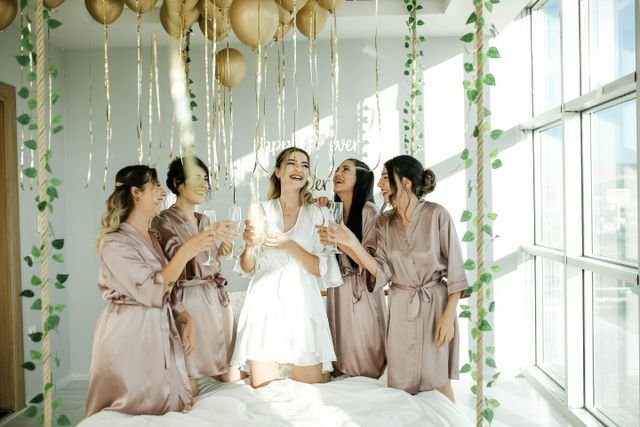 Bridesmaids preparing hen party decorations in Bristol