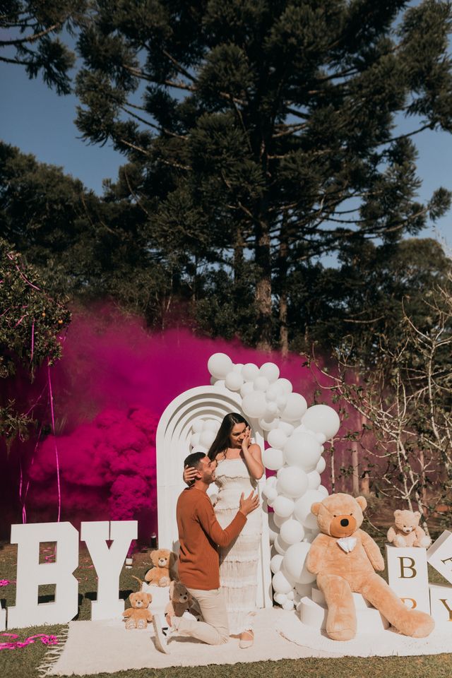 Expectant parents celebrating a gender reveal party moment in Bristol