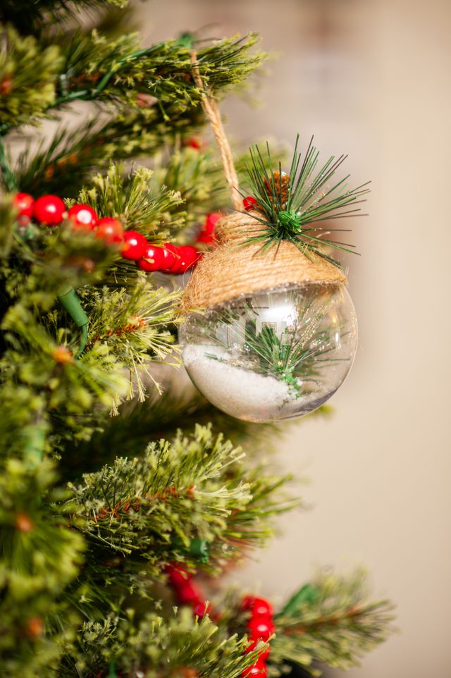 professionally layered christmas tree decorations showing large and small ornaments