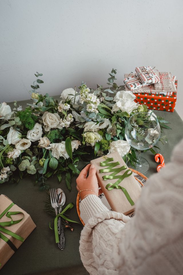 Adding finishing details when styling christmas table decorations