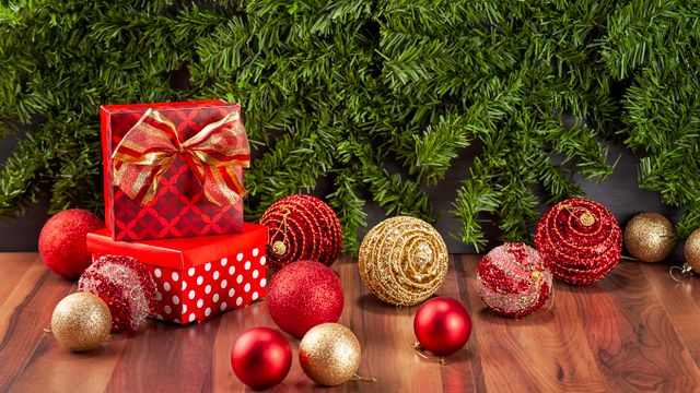 Carefully wrapping Christmas decorations for storage after taking them down in January